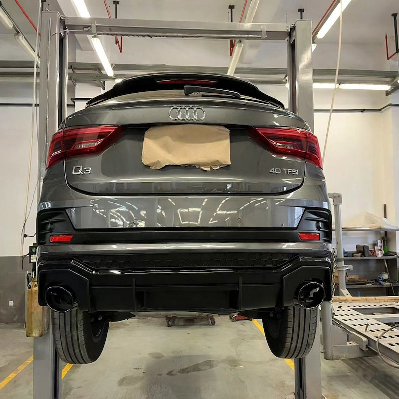 Gloss black rear diffuser on 2023 Audi Q3 SUV 2.0T with exhaust tips